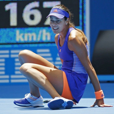 Ana Ivanovic of Serbia falls during her women's singles first round match against Lucie Hradecka of Czech Republic at the Australian Open 2015 tennis tournament in Melbourne January 19, 2015. Ivanovic lost the match to Hradecka. REUTERS/Issei Kato