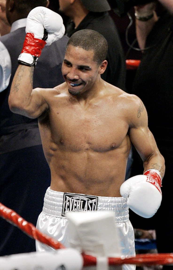 U.S. Olympic gold medalist Andre Ward, making his professional boxing debut, celebrates after defeating super-middleweight opponent Christopher Molina during the second round of their bout in Los Angeles December 18, 2004.