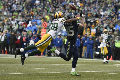 January 18, 2015; Seattle, WA, USA; Seattle Seahawks wide receiver Jermaine Kearse (15) catches a 35 yard pass from quarterback Russell Wilson (not pictured) for the game winning touchdown ahead of Green Bay Packers cornerback Tramon Williams (38) during 