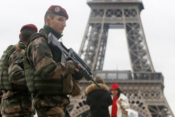 French soldier patrol near the Eiffel Tower in Paris as part of the highest level of &quot;Vigipirate&quot; security plan after a shooting at the Paris offices of Charlie Hebdo January 9, 2015. The two main suspects in the weekly satirical newspaper Charl