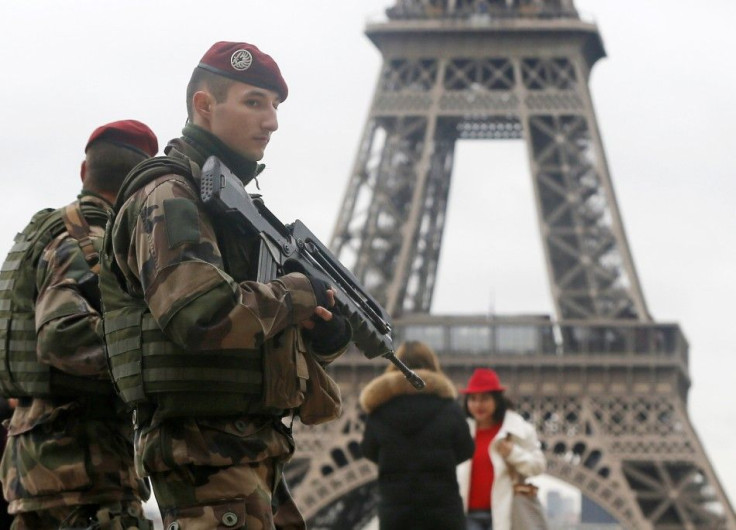French soldier patrol near the Eiffel Tower in Paris as part of the highest level of &quot;Vigipirate&quot; security plan after a shooting at the Paris offices of Charlie Hebdo January 9, 2015. The two main suspects in the weekly satirical newspaper Charl