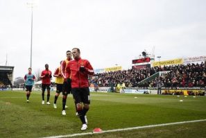 Manchester United players warm up ahead of their FA Cup third round soccer match against Yeovil at Huish Park, Yeovil, western England, January 4, 2015.