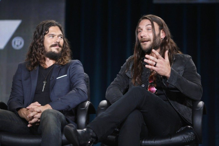 Actors Luke Arnold (L) and Zach McGowan participate in the Starz "Black Sails" panel