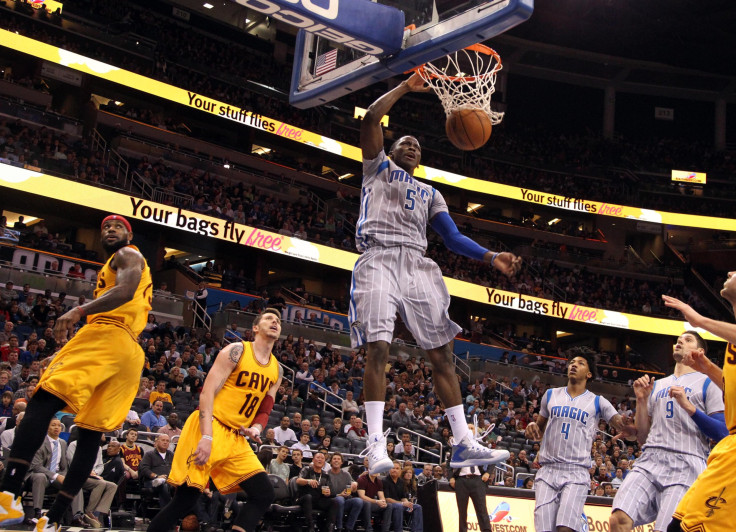 Dec 26, 2014; Orlando, FL, USA; Orlando Magic guard Victor Oladipo (5) dunks over Cleveland Cavaliers forward LeBron James (23) during the second half at Amway Center. Cleveland Cavaliers defeated the Orlando Magic 98-89.