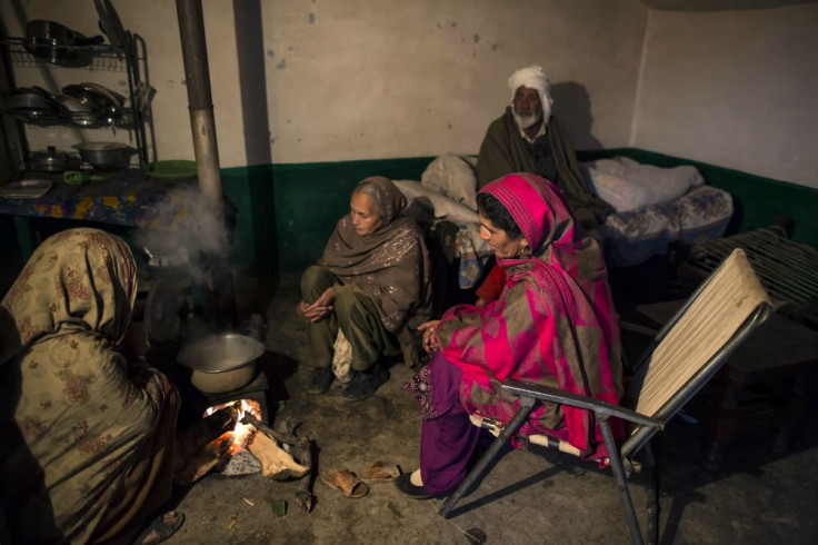 A family site around a wood fire