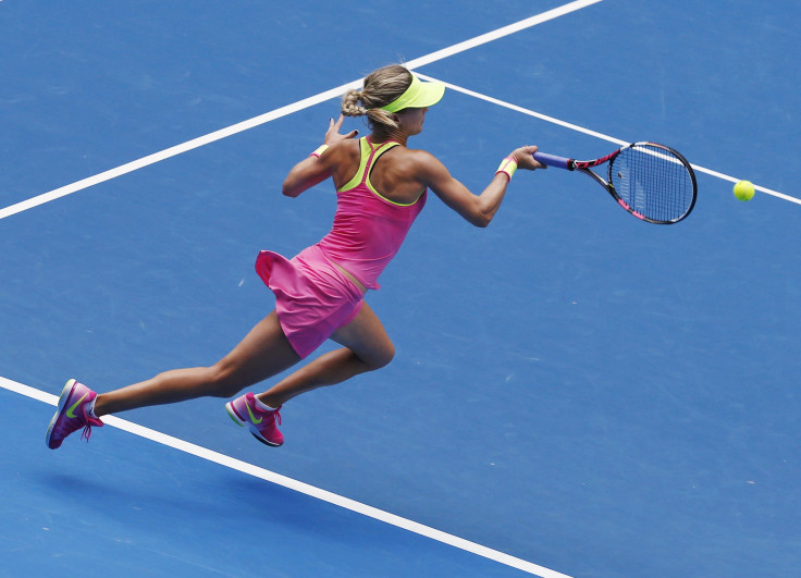 Eugenie Bouchard of Canada runs to hit a return to Irina-Camelia Begu of Romania