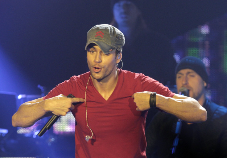 Singer Enrique Iglesias performs on stage during his "Sex and Love Tour" in Riga December 7, 2014. REUTERS/Ints Kalnins (LATVIA - Tags: ENTERTAINMENT) - RTR4H1NO