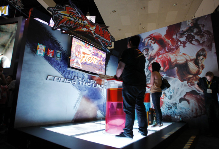 IN PHOTO: Gamers play the Capcom Entertainment, Inc.'s "Street Fighter X Tekken" video game using the arcade style Street Fighter X Tekken FightStick PRO during the Electronic Entertainment Expo or E3 in Los Angeles June 7, 2011. 