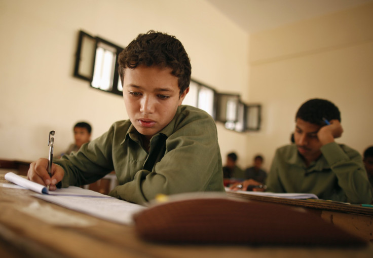 Students take the final examination of their primary school in Sanaa June 25, 2013. The final examination is held during the 9th grade of primary education in Yemen. 