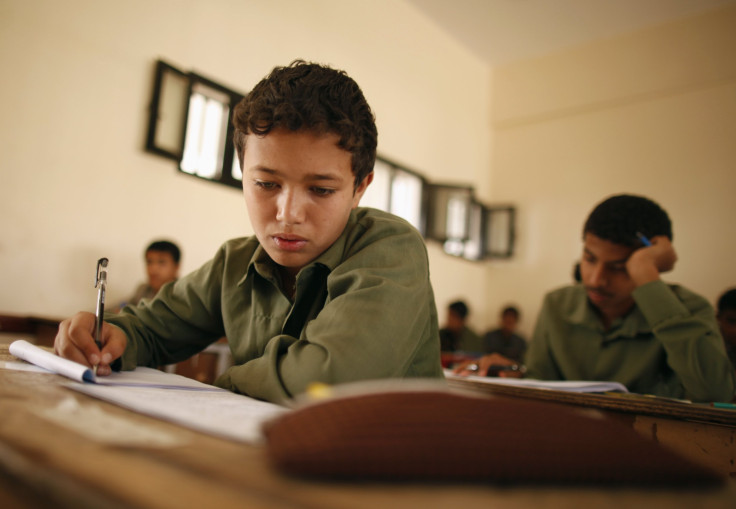 Students take the final examination of their primary school in Sanaa June 25, 2013. The final examination is held during the 9th grade of primary education in Yemen.