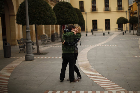 A man embraces and kisses a woman during the International Day for the Elimination of Violence against Women in downtown Ronda, near Malaga, southern Spain, November 25, 2014. 