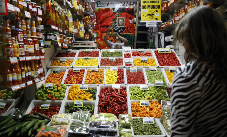 A woman looks at chillies and peppers at a market in Belo Horizonte June 30, 2014. In a project called "On The Sidelines" Reuters photographers share pictures showing their own quirky and creative view of the 2014 World Cup in Brazil. 