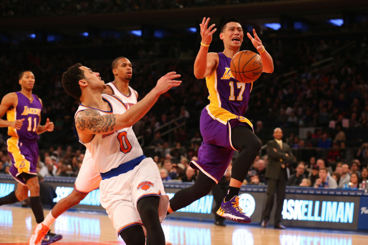 New York Knicks guard Shane Larkin (0) fouls Los Angeles Lakers guard Jeremy Lin (17) during the second quarter at Madison Square Garden.