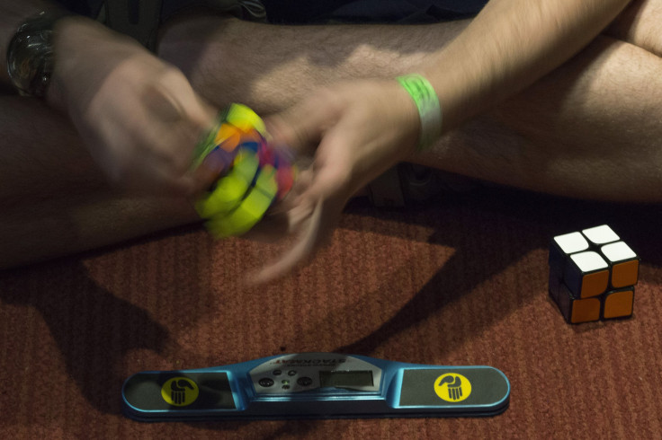 A participant practices to compete at the National Rubik's Cube Championship at Liberty Science Center in Jersey City, New Jersey August 1, 2014. REUTERS/Eduardo Munoz