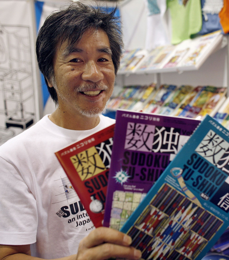 'Father of Sudoku' Maki Kaji holds copies of the latest sudoku puzzles at the Book Expo, in New York, June 3, 2007.