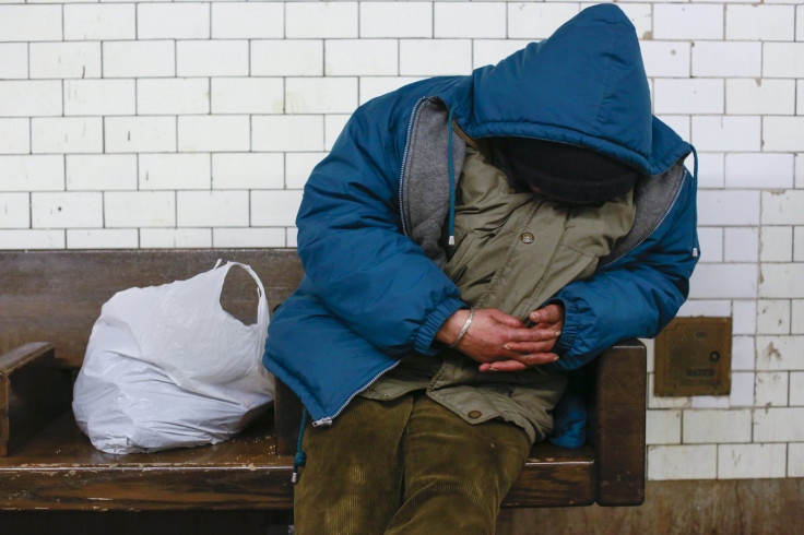 A man sleeps on a bench