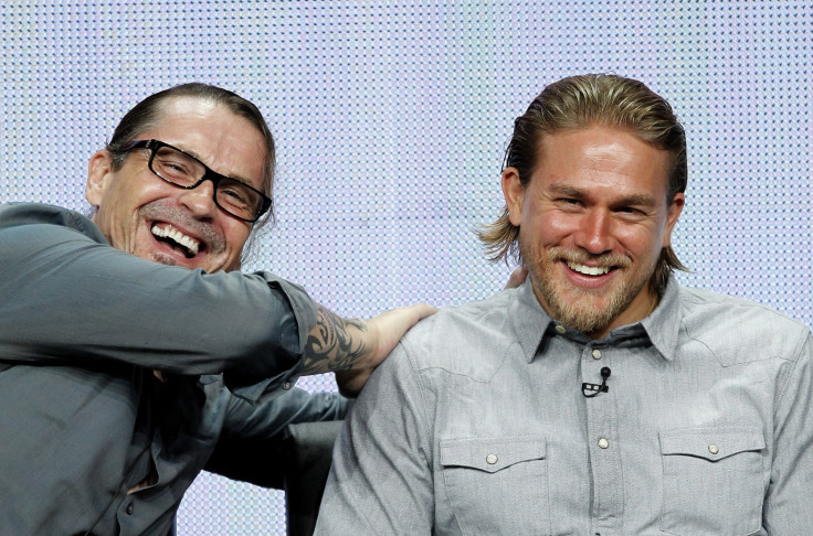 Creator and Executive Producer Kurt Sutter (L) jokes with cast member Charlie Hunnam at a panel for the television series "Sons of Anarchy" 