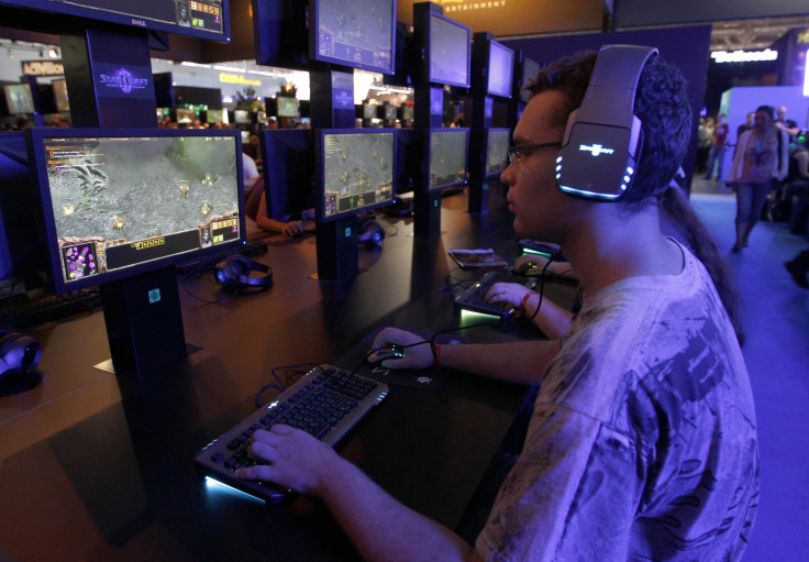 Visitors play ''Starcraft'' at the Blizzard exhibition stand during the Gamescom 2011 fair in Cologne August 18, 2011. The Gamescom convention, Europe's largest video games trade fair, runs from August 17 to August 21.   