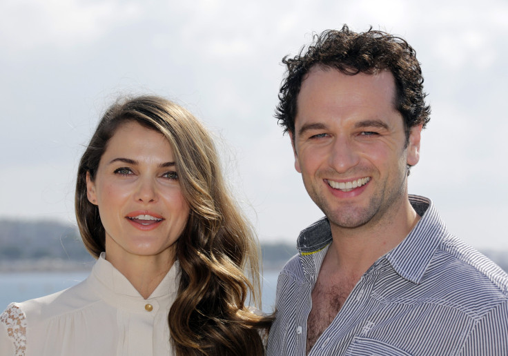 Actors Kerri Russell (L) and Matthew Rhys pose during a photocall for the television series "The Americans" 