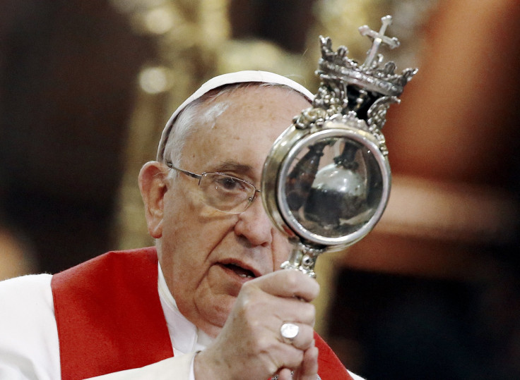 Pope Francis blesses the faithful with the vial of what local Roman Catholics believe is the blood of Saint Gennaro at a meeting with members of the clergy in the Duomo during his pastoral visit in Naples March 21, 2015.