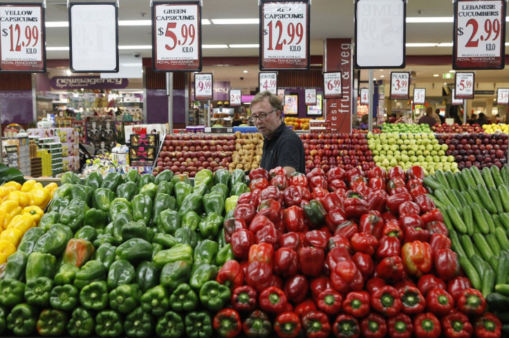 A customer walks through the fruits and vegetables section at a supermarket in Sydney April 27, 2011.
