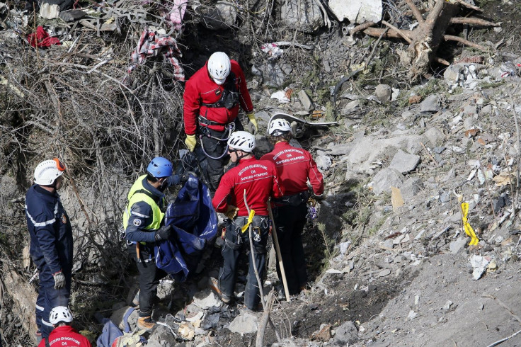 French rescue workers inspect the remains of the Germanwings Airbus A320 at the site of the crash, near Seyne-les-Alpes, French Alps March 29, 2015.