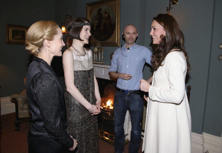  Britain's Catherine, Duchess of Cambridge, chats to actress Michelle Dockery (who plays Lady Mary Crawley) and Joanne Froggatt (who plays Anna Bates)  during a visit to the set of Downton Abbey