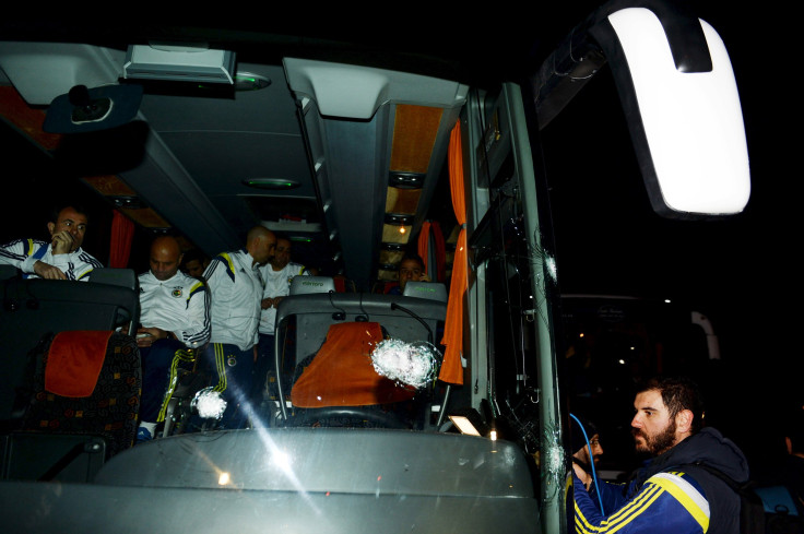 Fenerbahce officials and players sitting in the bus which was attacked by a gunman.