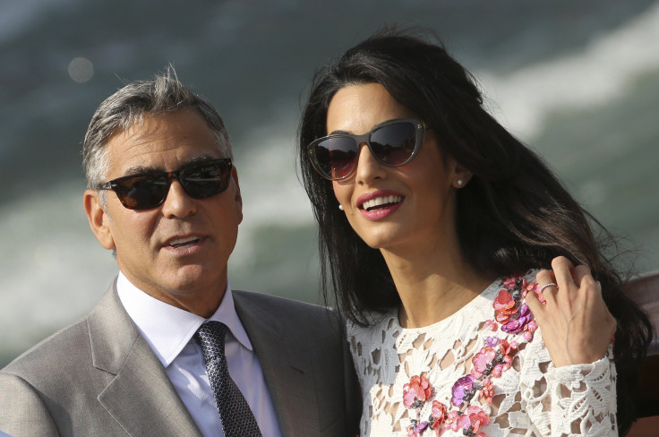 [8:44] U.S. actor George Clooney and his wife Amal Alamuddin travel on a water taxi at the Grand Canal in Venice September 28, 2014.