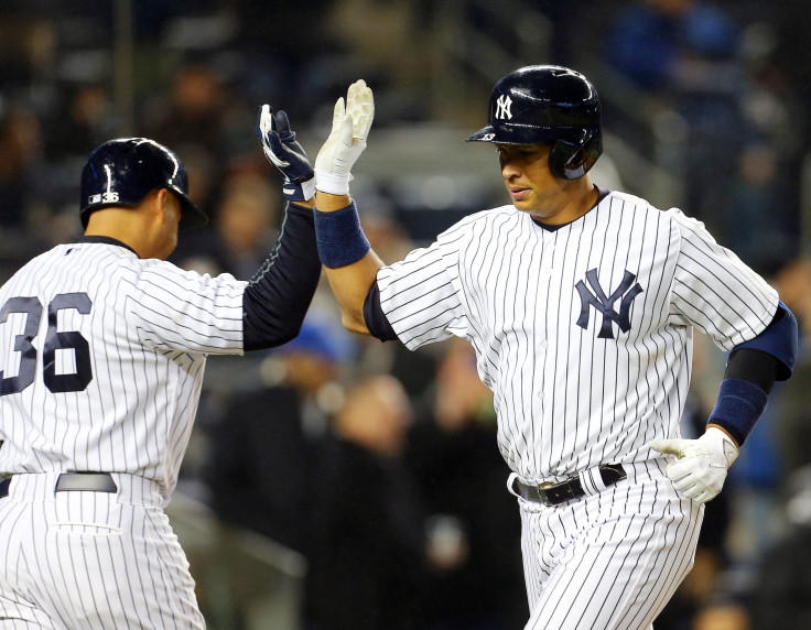 Alex Rodriguez celebrates after scoring a single home run.