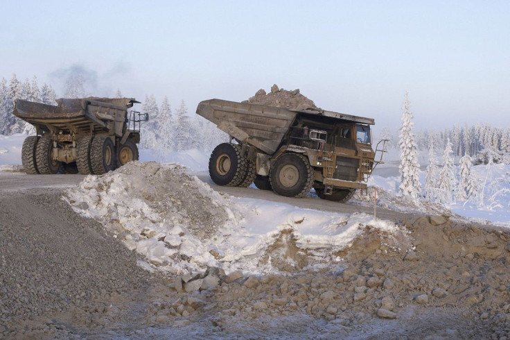 Dump trucks drive along a road at Talvivaara's nickel mine in Sotkamo January 16, 2013, in this picture provided by Lehtikuva. 