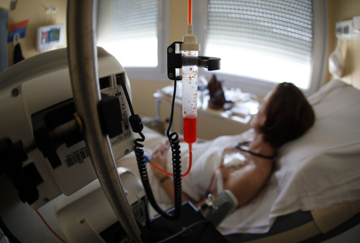 A patient receives chemotherapy treatment for breast cancer at the Antoine-Lacassagne Cancer Center in Nice July 26, 2012.