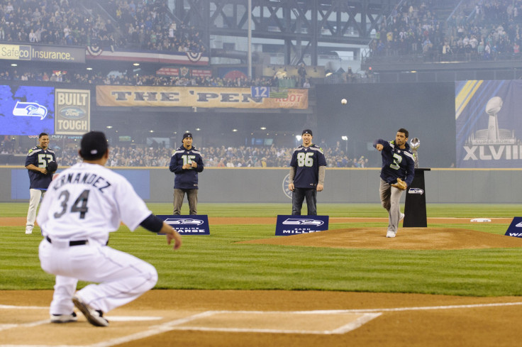Seattle Seahawks quarterback Russell Wilson throws out the first pitch
