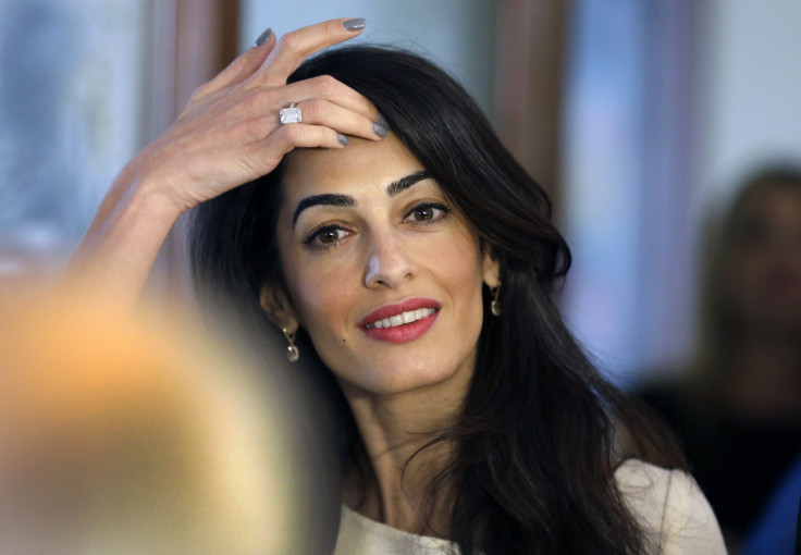 [8:45] Human rights lawyer Amal Alamuddin Clooney is pictured before a meeting in the Greek Culture Ministry in Athens