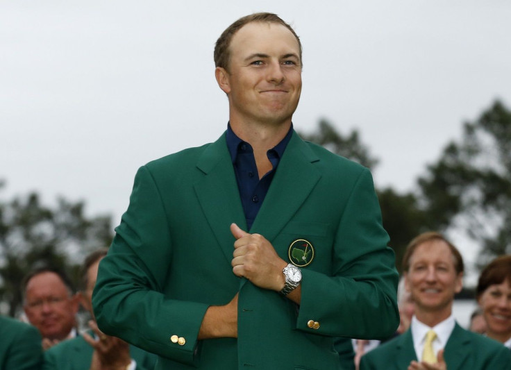 Jordan Spieth of the U.S. smiles as he wears his Champion's green jacket on the putting green after winning the Masters golf tournament at the Augusta National Golf Course in Augusta, Georgia April 12, 2015.