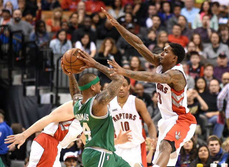 Lou Williams (R) attempts to block a shot.