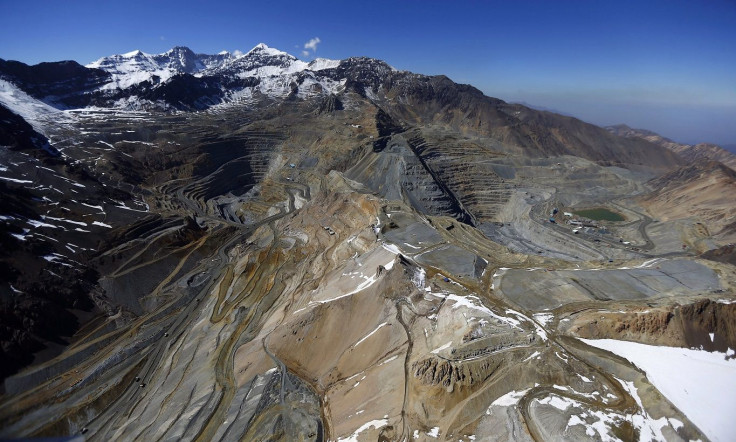 An aerial view of open pits of CODELCO's Andina (L) and Anglo American's Los Bronces copper mines with Olivares glaciers in the background (top L) at Los Andes Mountain range, near Santiago city, November 17, 2014.