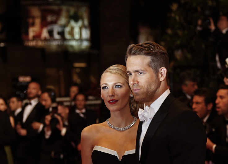  Cast member Ryan Reynolds (R) and his wife actress Blake Lively pose on the red carpet as they arrive for the screening of the film "Captives" 