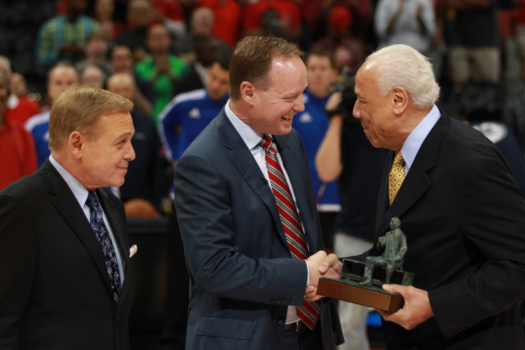 Atlanta Hawks coach Mike Budenholzer receives his Coach of the Year award.