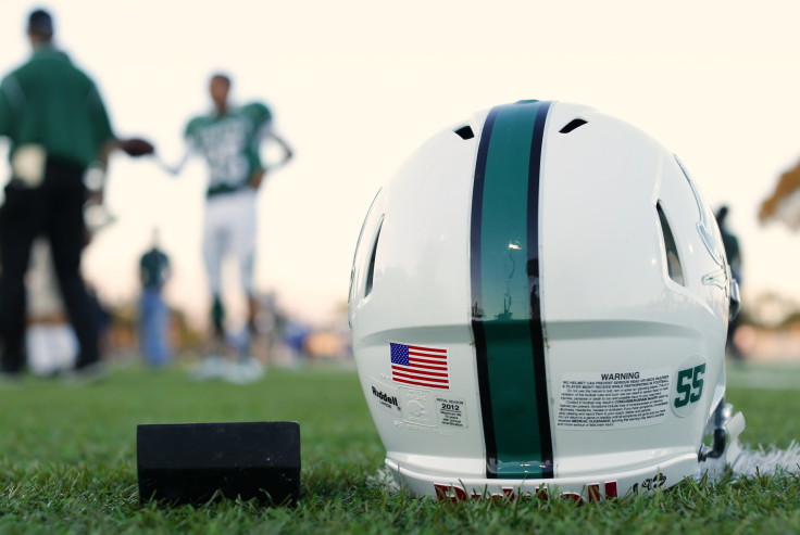 A football helmet lying on the ground.