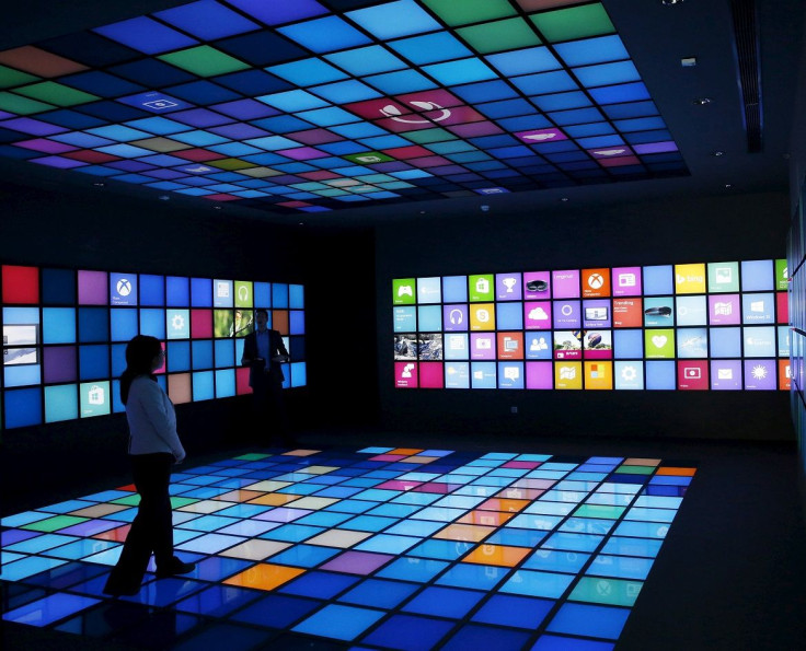 A reporter looks around a display of Microsoft China Center One during a media tour in Beijing April 14, 2015.