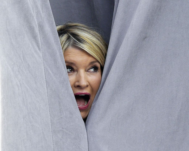 TV personality Martha Stewart poses behind the drapes during Comedy Central Roast of Justin Bieber at Sony Studios in Culver City