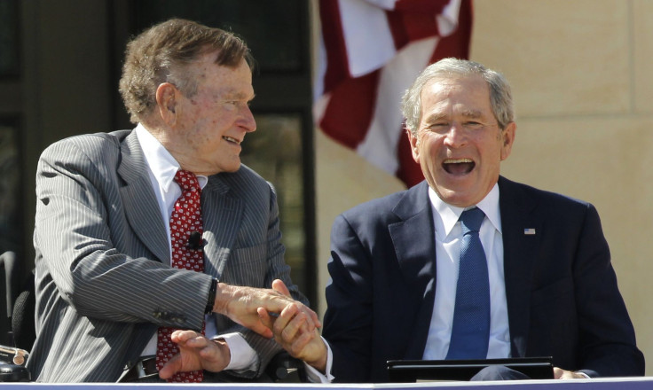 Father and son, and former U.S. Presidents, George H.W. Bush (L) and George W. Bush