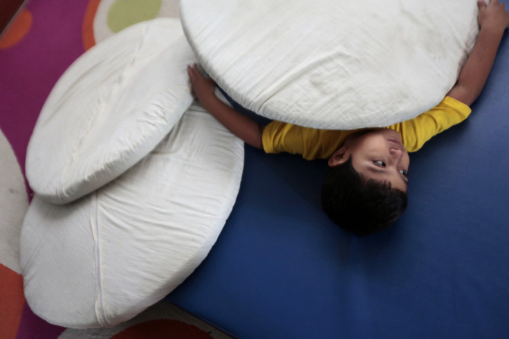 Autistic Boy Laying In A Therapy Center