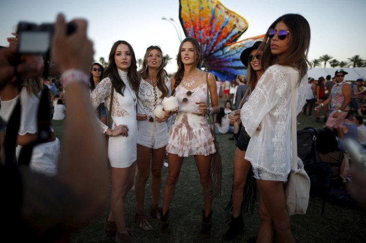 [6:40] Victoria's Secret model Alessandra Ambrosio of Brazil (C) poses for a photo with friends at the Coachella Valley Music and Arts Festival 