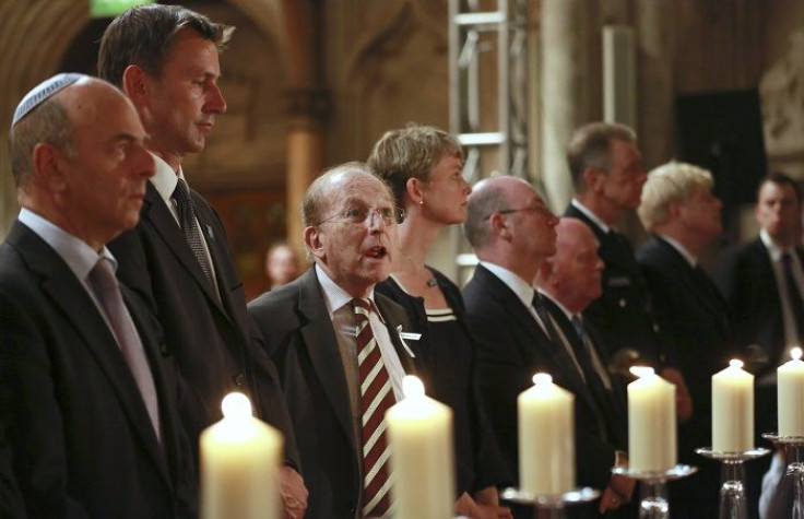 Lord Greville Janner (3rd L) sings a Hebrew prayer