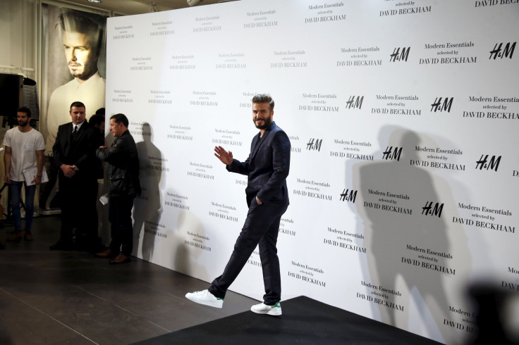 [7:46] Former England soccer captain David Beckham waves after posing for photographers at a H&M store