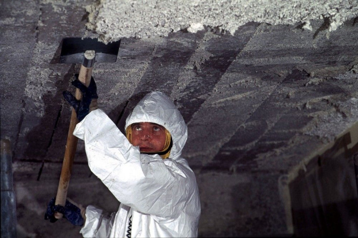 Worker Removes Asbestos