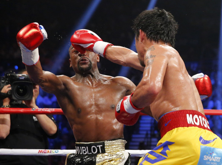 Pacquiao of the Philippines lands a right against Mayweather, Jr. of the U.S. in the fifth round