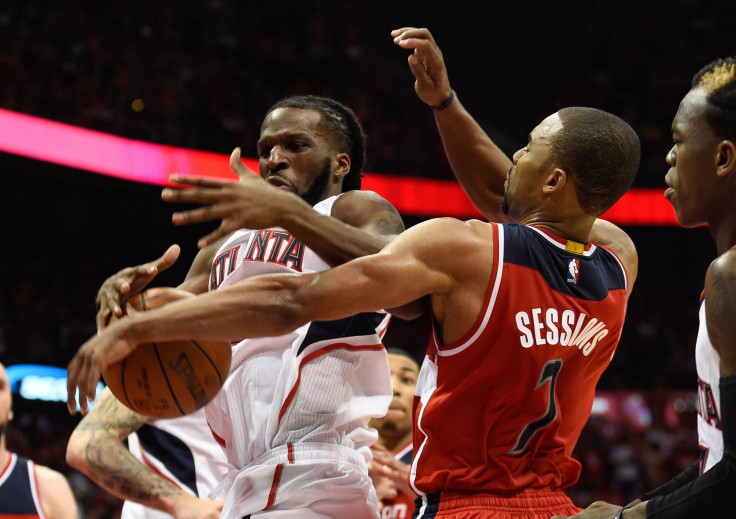 DeMarre Carroll and Ramon Sessions in action.